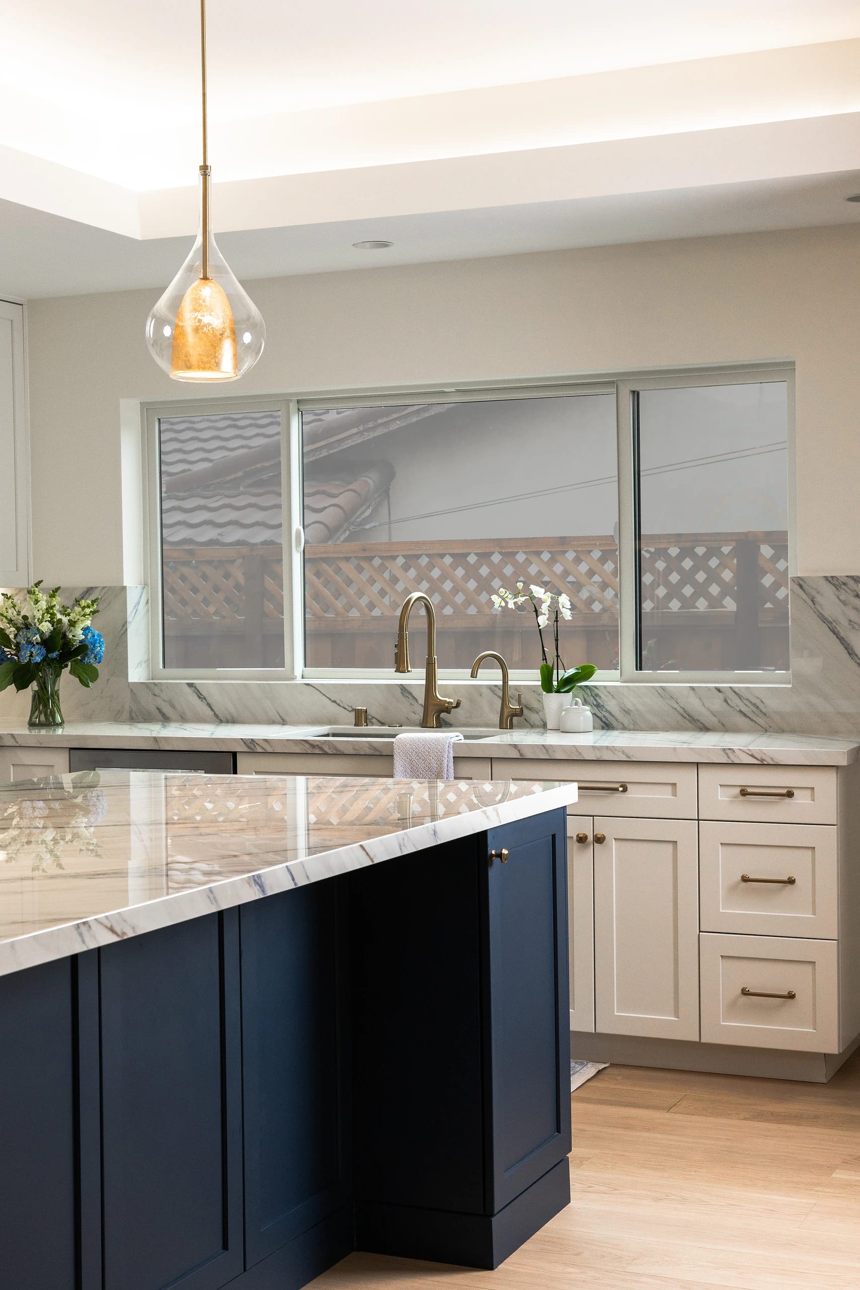 Bright transitional kitchen with custom cabinetry and a large island