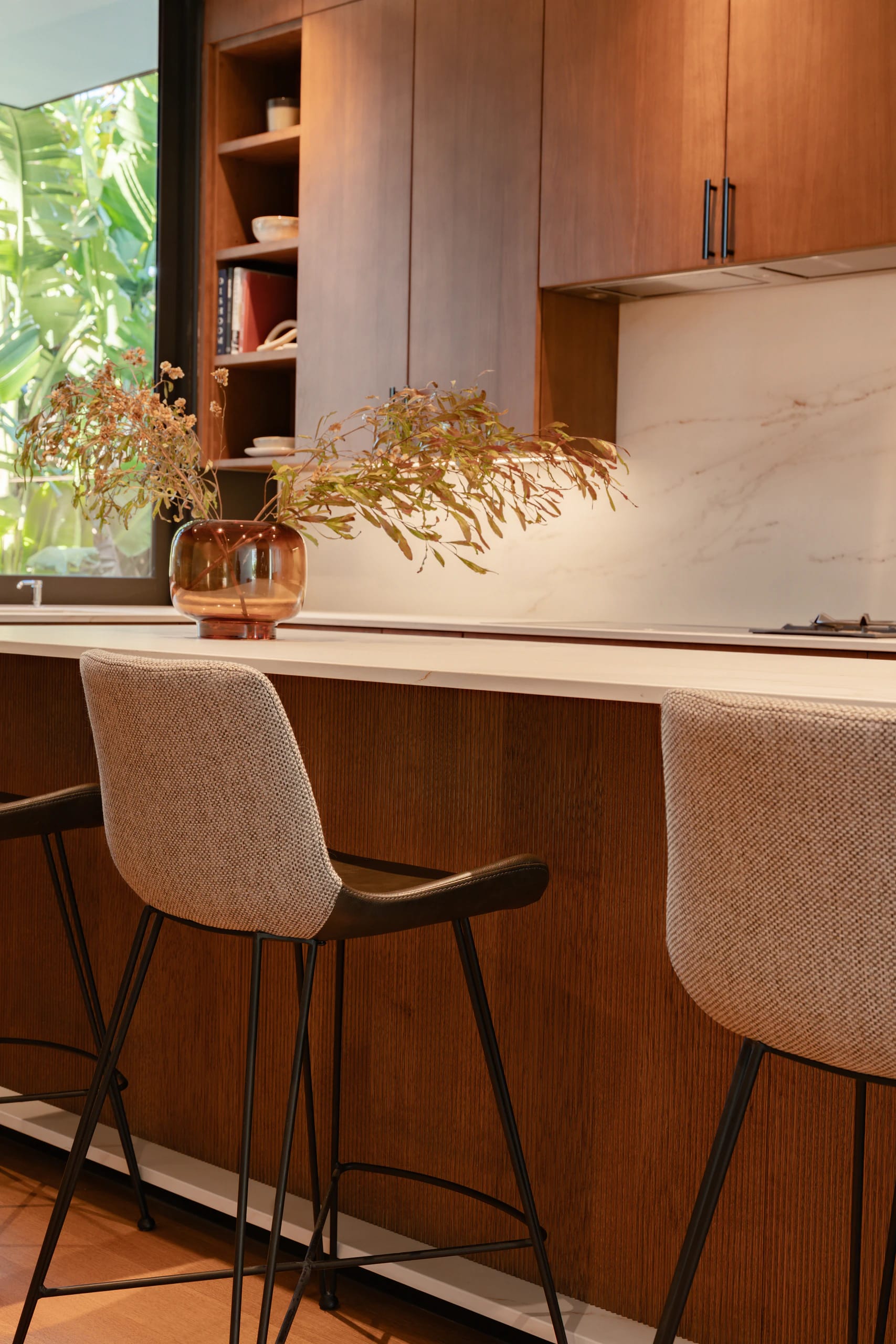 Clean-lined DOCA kitchen with natural wood cabinetry and open sightlines