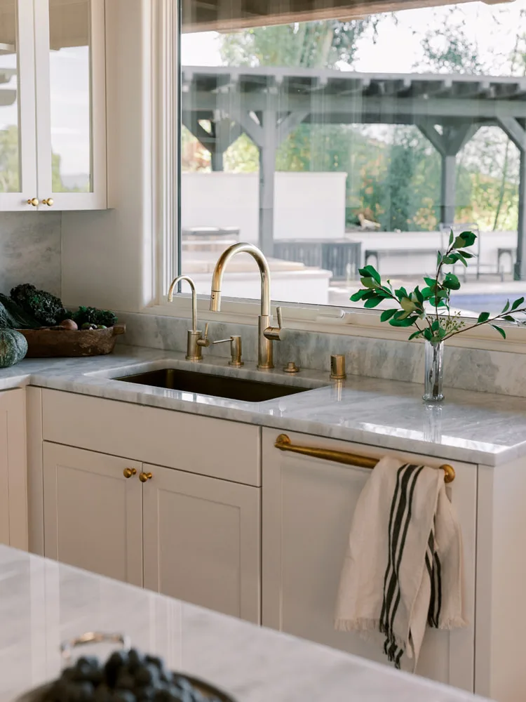 Transitional kitchen featuring Crystal Cabinets with natural wood accents, blending refined rustic elegance with modern design elements.