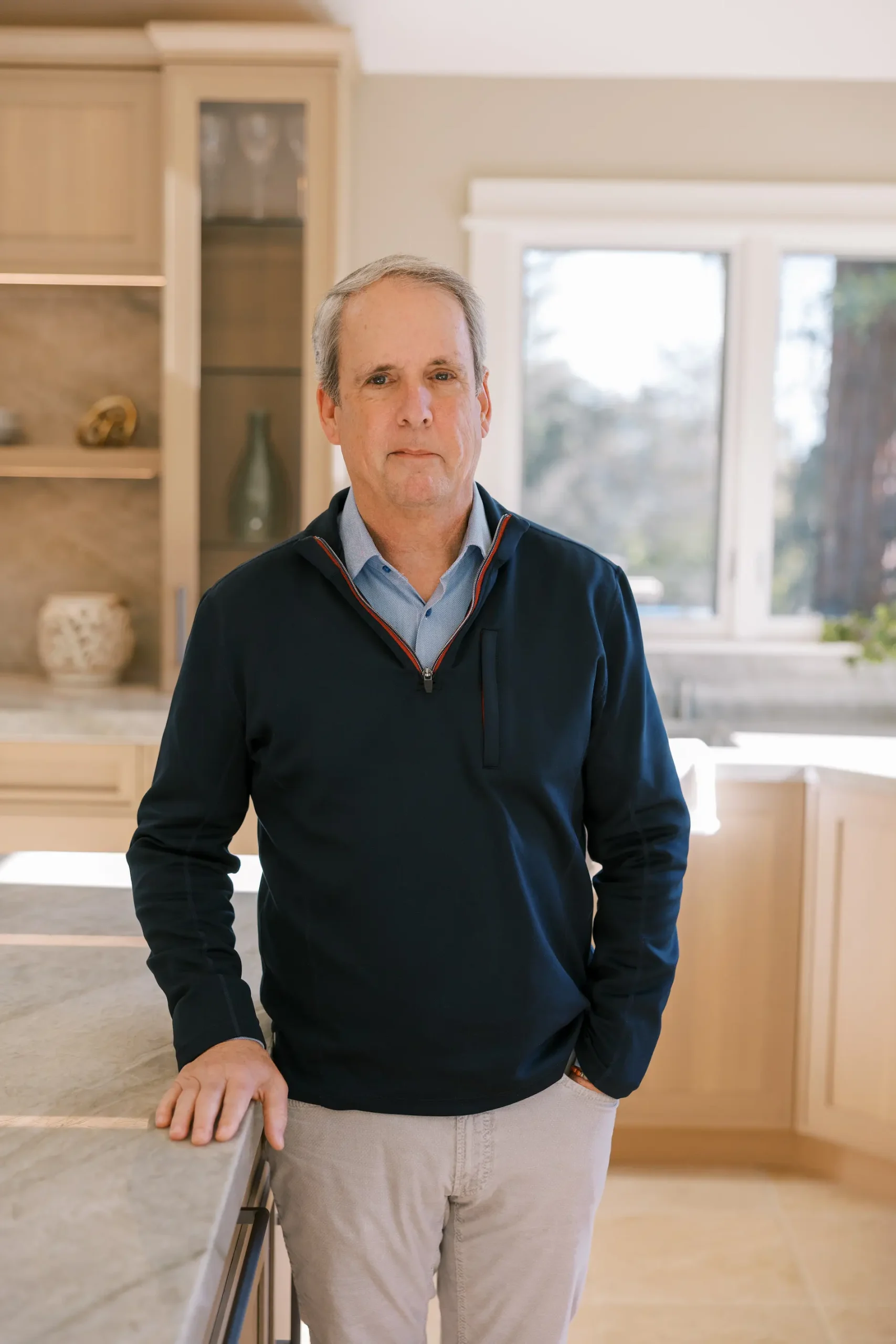Senior Designer Mike Ryan in a Wood-Mode kitchen he designed
