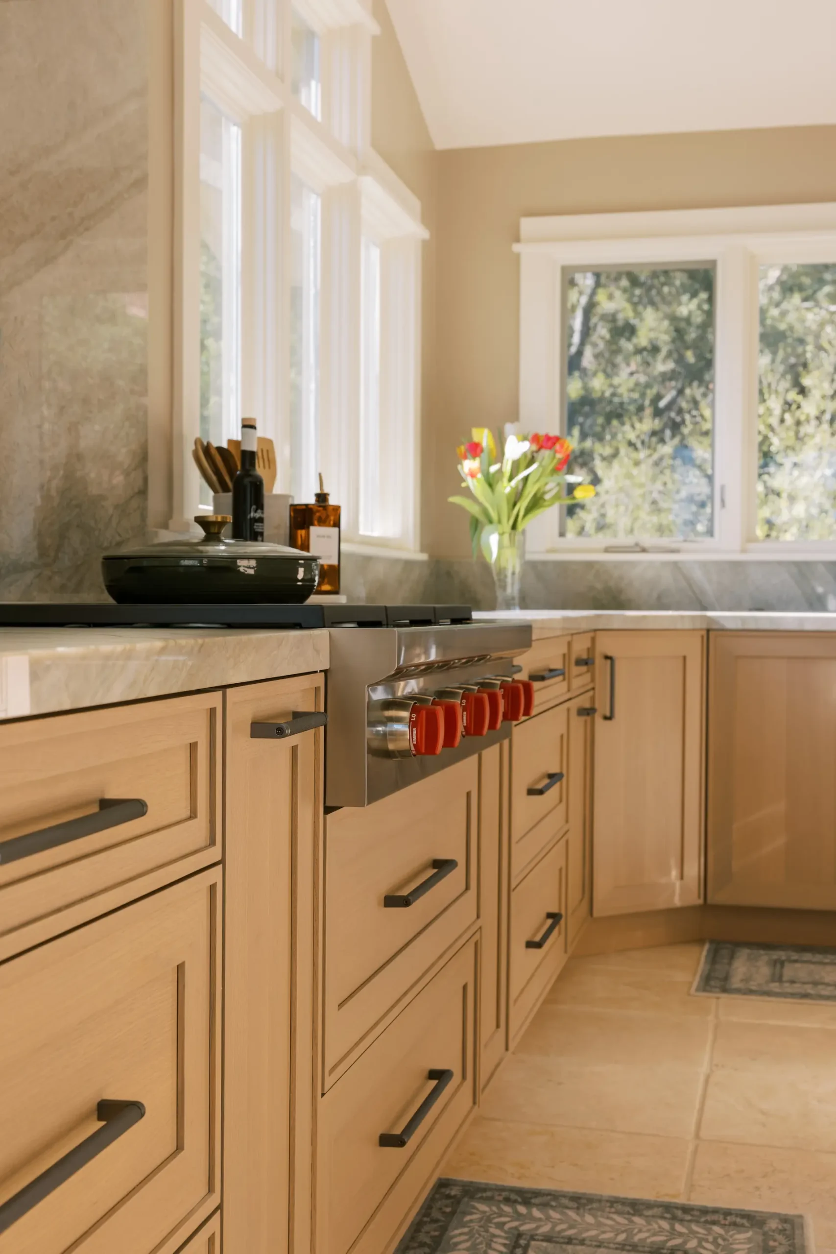 Light-filled contemporary kitchen showcasing Wood-Mode cabinets, and a bright elegant interior