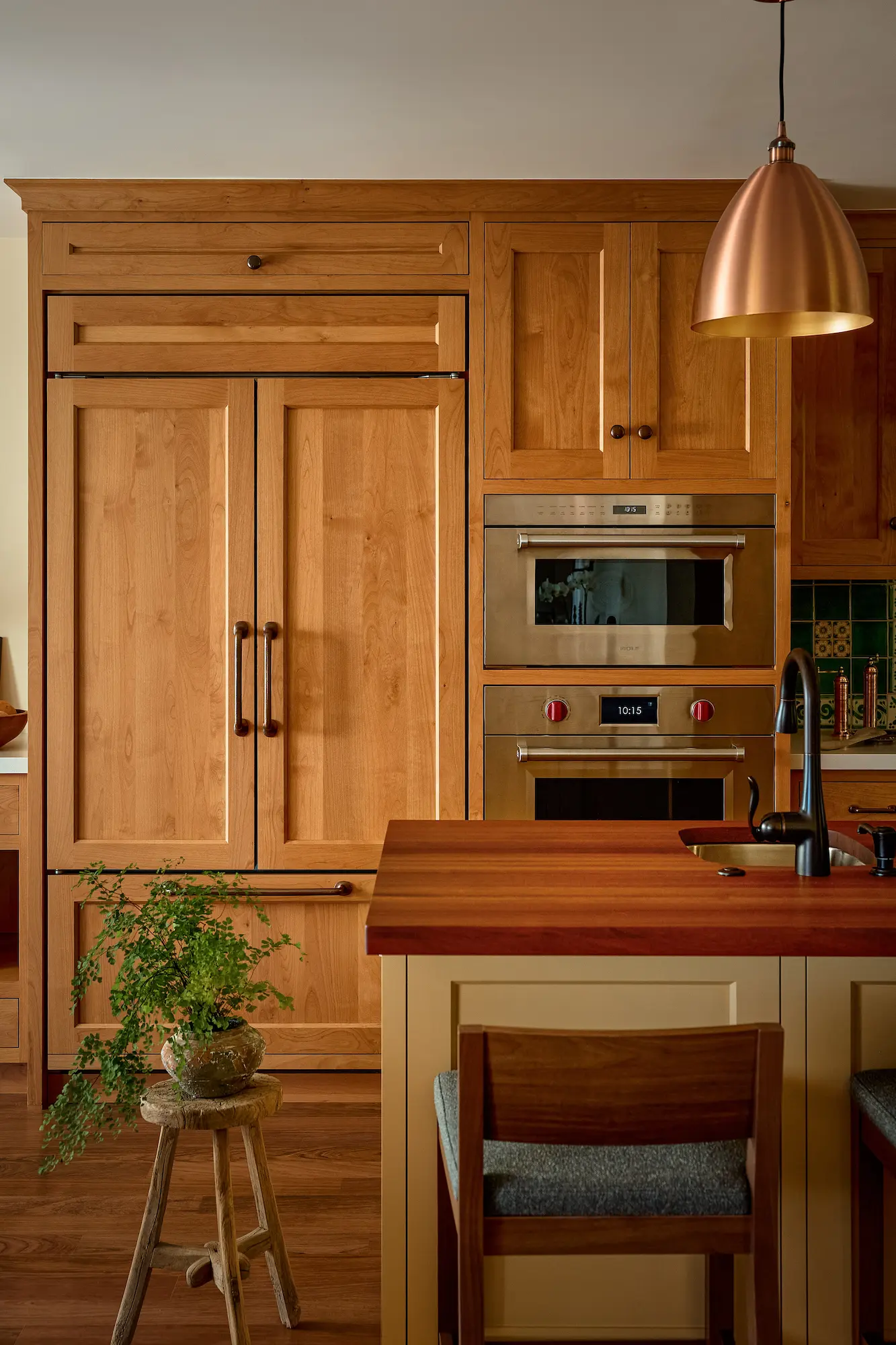 Warm Artisan Glow luxury transitional kitchen with custom cabinetry