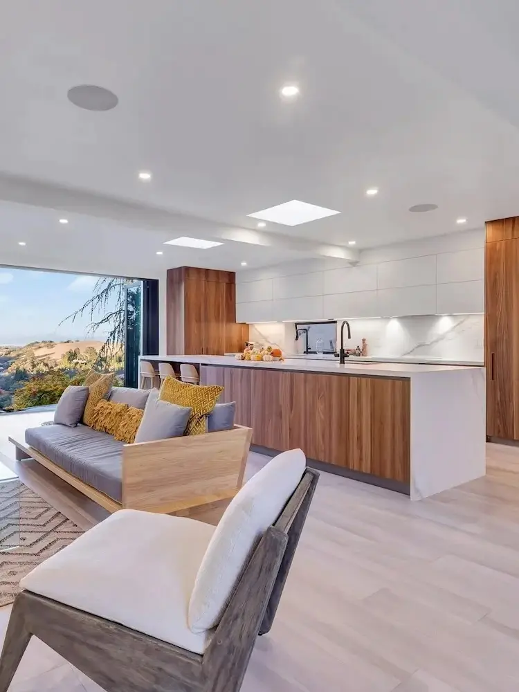 Kitchen with open layout, walnut cabinets, and marble countertops