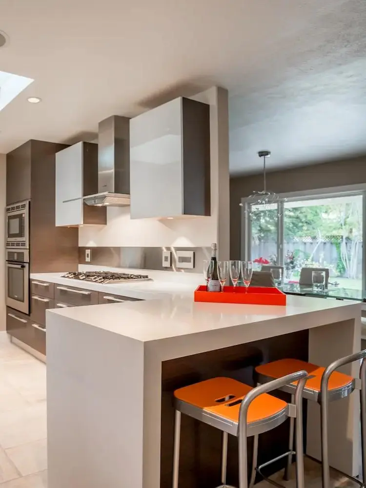 mid-century modern kitchen with sleek design and bright accent colors