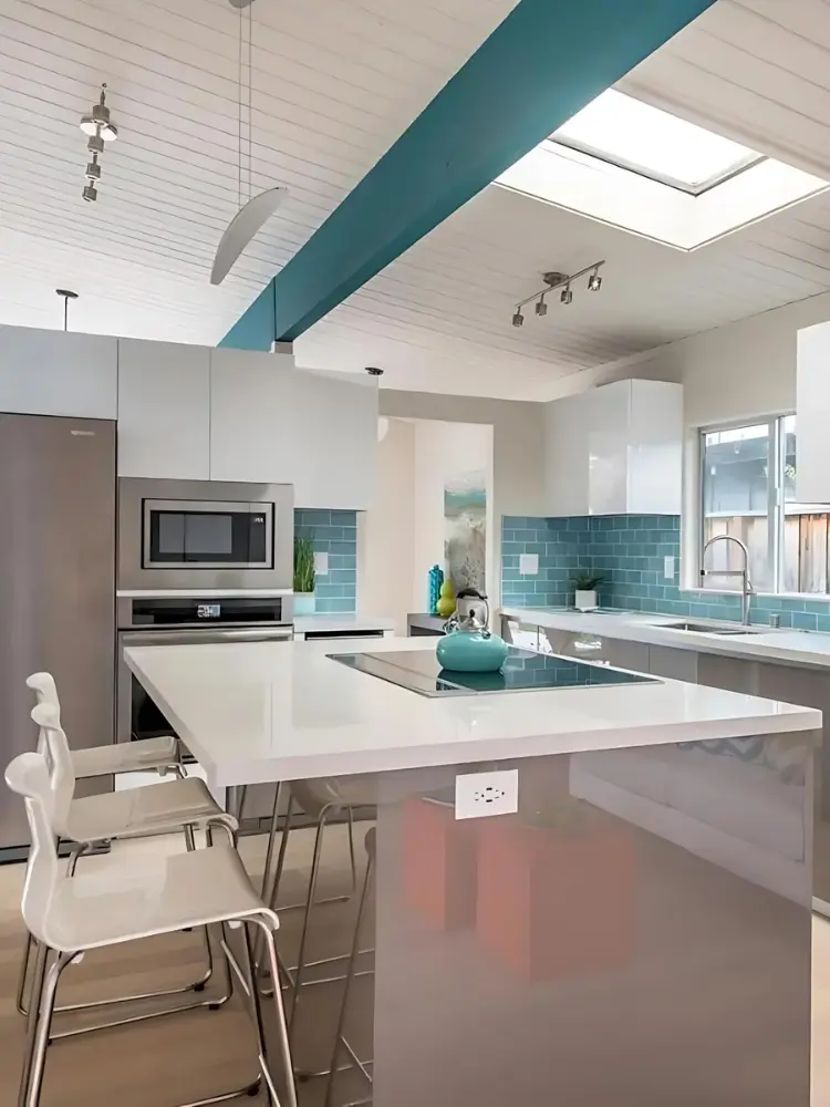 Stylish mid-century modern living space with teal ceiling beams, a contemporary kitchen, and a cozy seating area with colorful accents