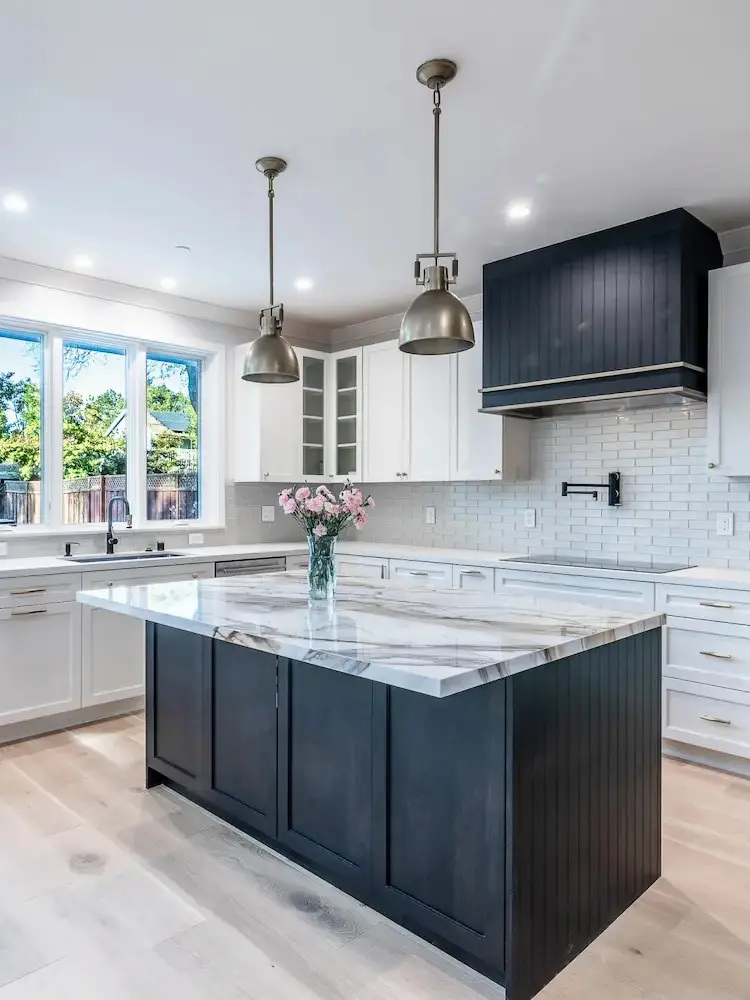 Modern kitchen with large island and stainless steel appliances - featured image