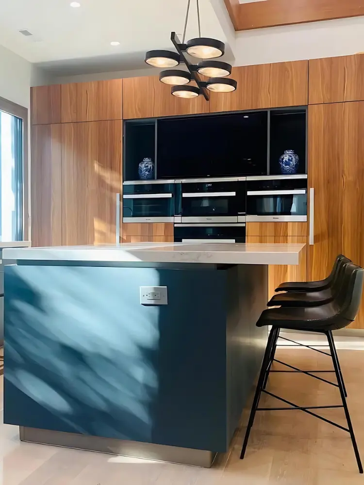 Luxurious kitchen showcasing modern fixtures, blue and wood tones, and spacious layout