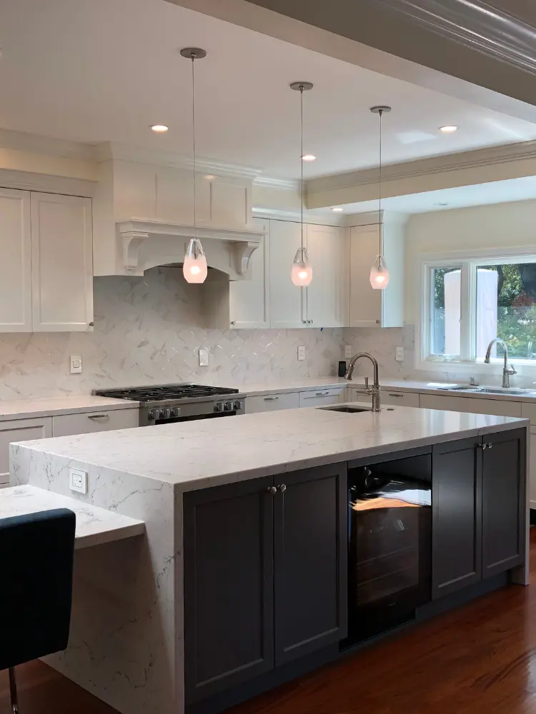 Luxury kitchen featuring a large marble island and modern appliances