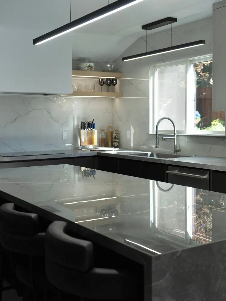 Luxurious modern kitchen with dark marble countertops, stainless steel fixtures, and stylish lighting for a high-end look