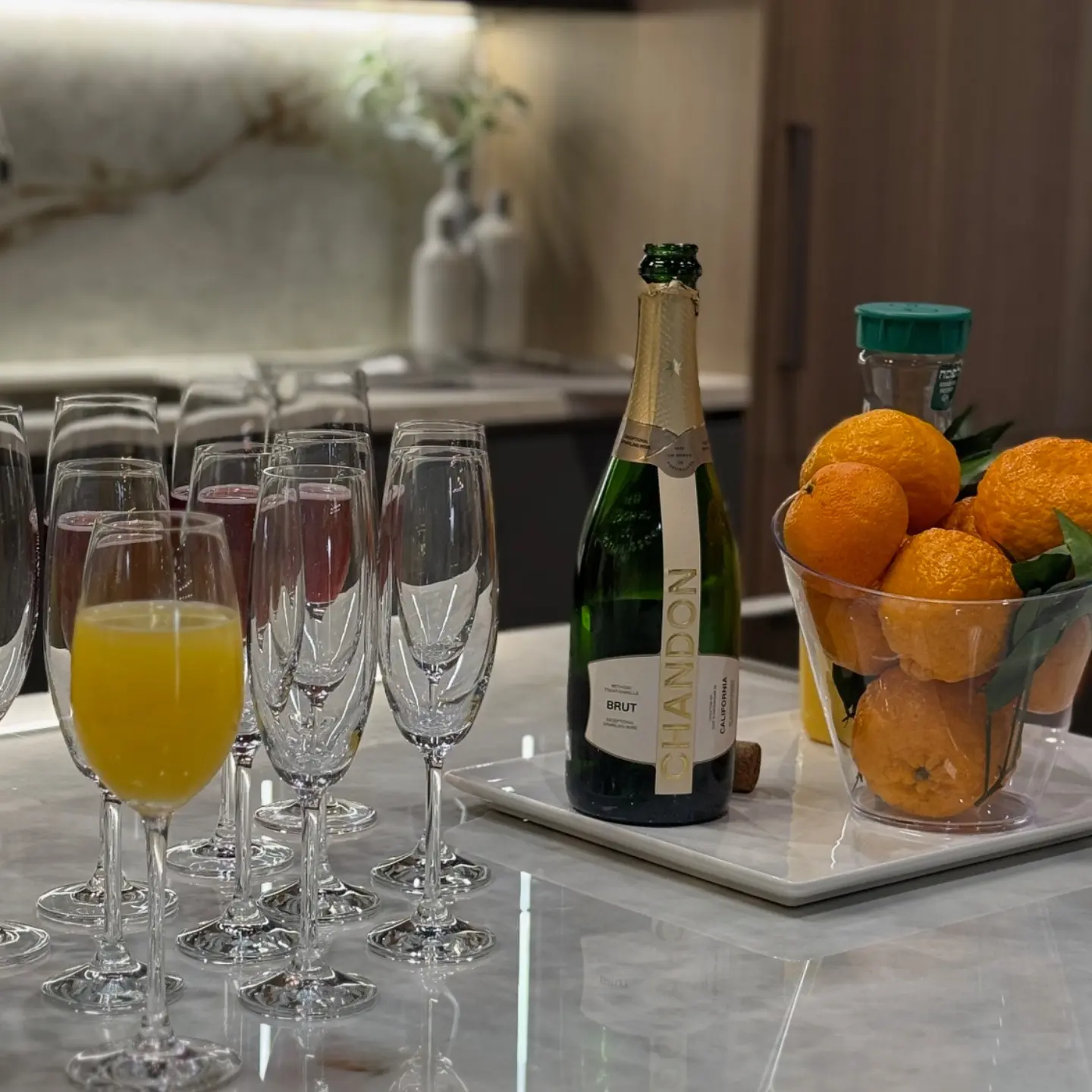 Drinks, a wine bottle and oranges at the Ogawa Fisher trade event