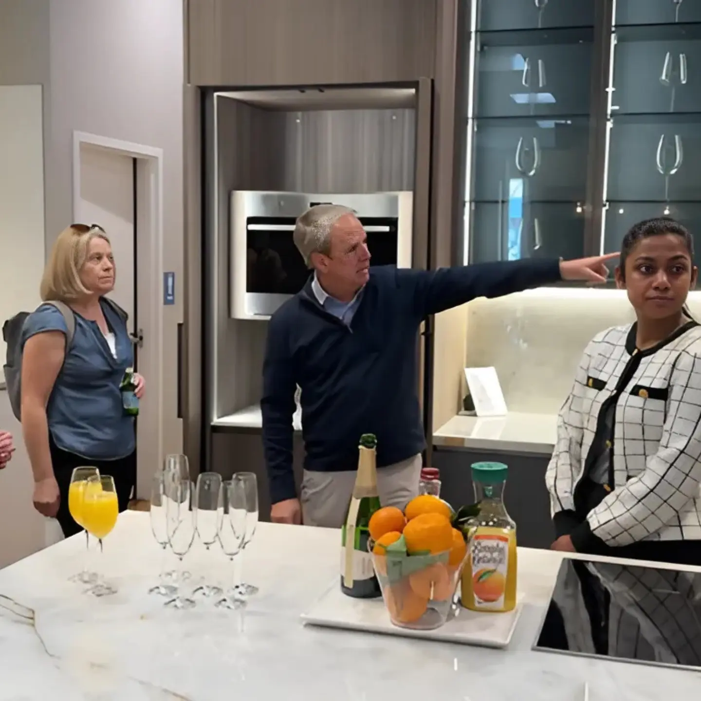 Three guests at a counter at the Ogawa Fisher trade event