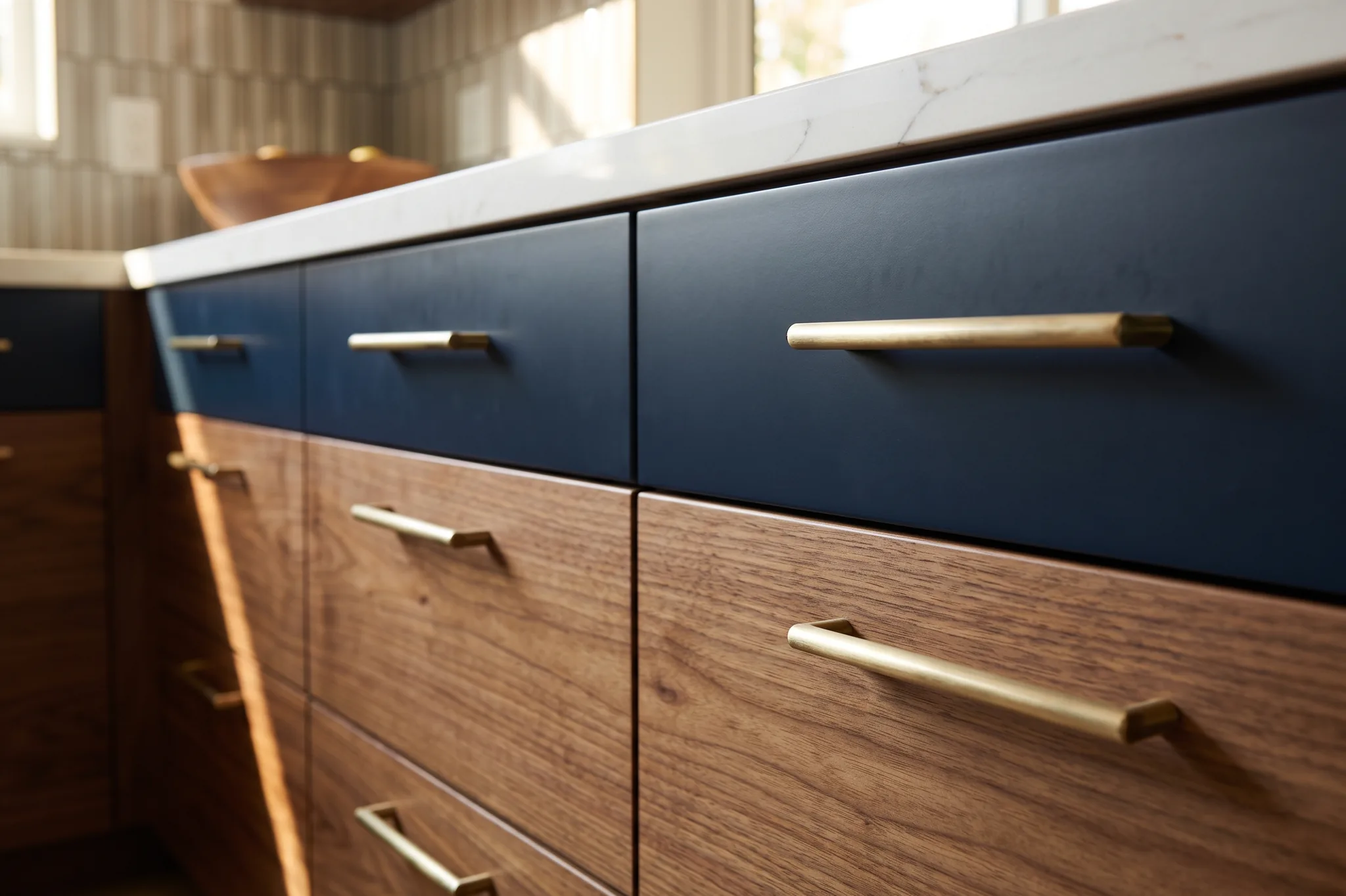 Walnut and navy drawers with matching solid brass bar pulls